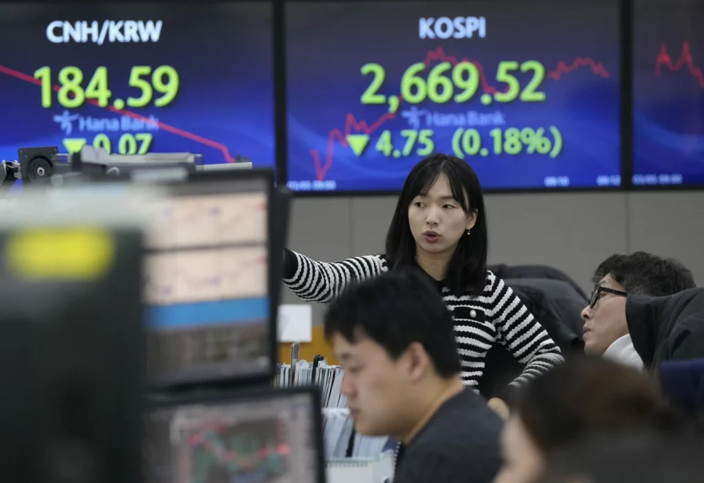 Stock market today: Asian shares are mixed as China unveils 5% economic growth target for 2024